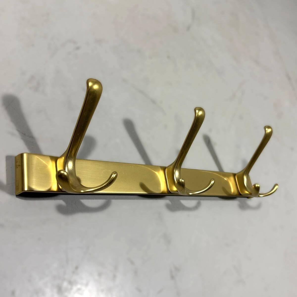 Gold coloured aluminium wall coat racks 1960’s