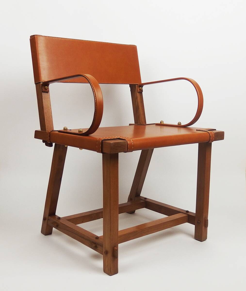 Leather armchair by Jacques Adnet