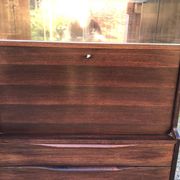 Vintage Scandinavian secretary in rosewood with drawers featuring fin-style handles.