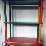 Shelf on legs, library, crayons in 4 colours.