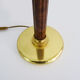 Mazda lamp in gilded metal, foot imitation wood and white opaline. Year 60