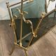 Brass magazine rack and blue-tinted glasses
