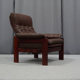 Pair of armchairs and ottoman in leather, 1970