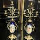 Pair of candlesticks. Bronze, brass, porcelain.