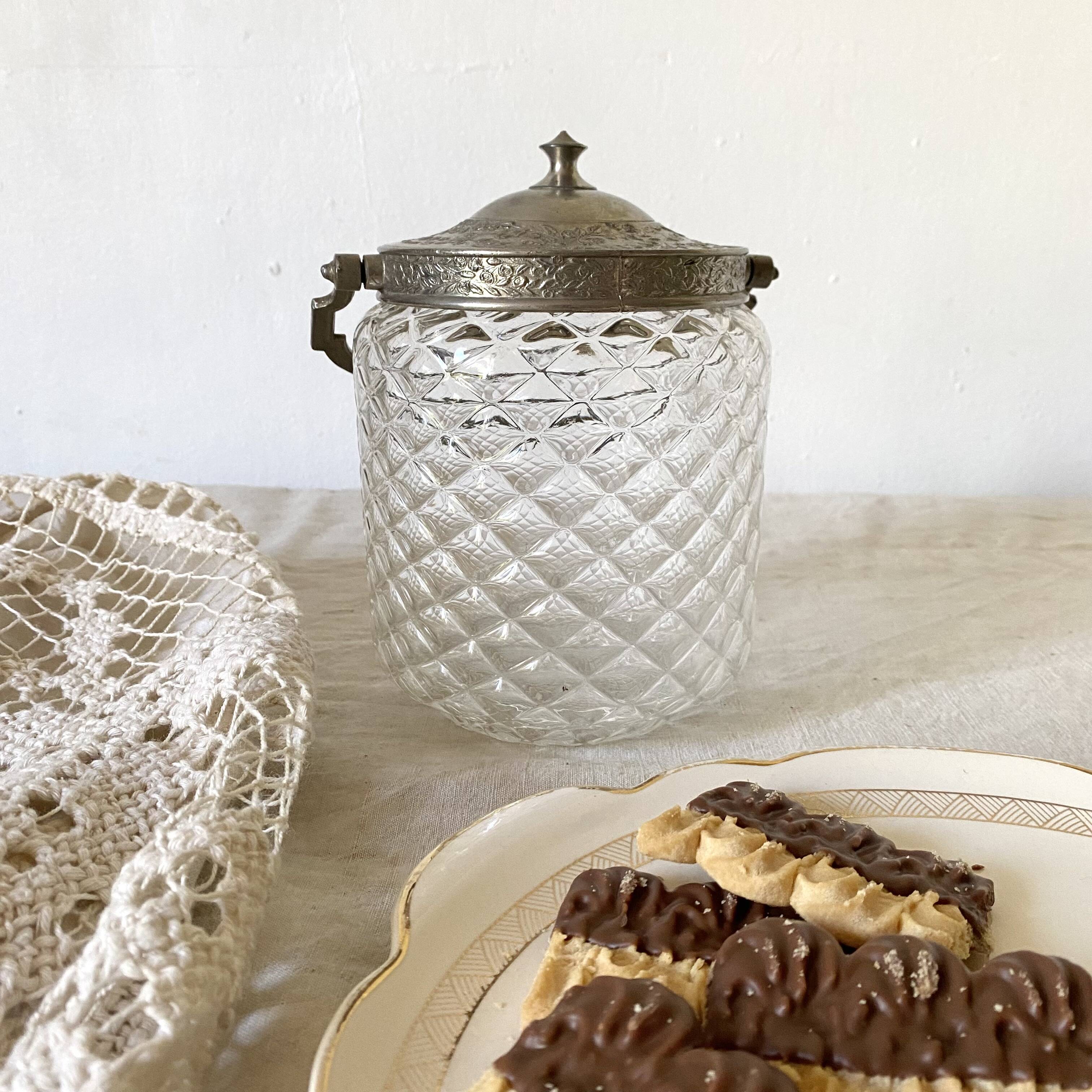 Old biscuit bucket in glass and metal