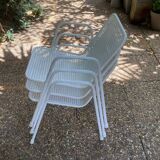 Perforated metal armchairs