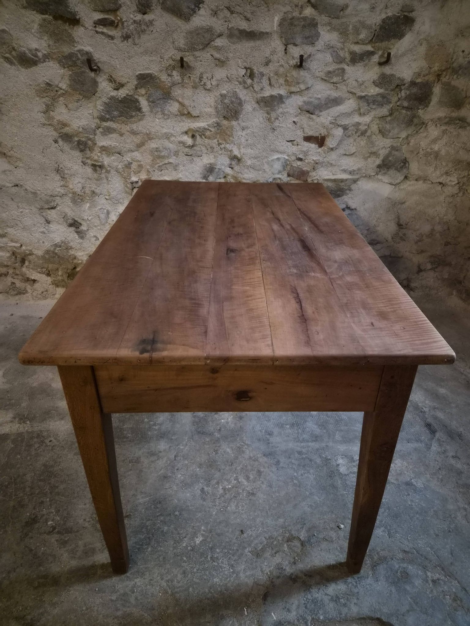 French antique dining table in cherry wood with two drawers, circa 1880–1920.