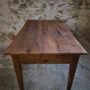 French antique dining table in cherry wood with two drawers, circa 1880–1920.