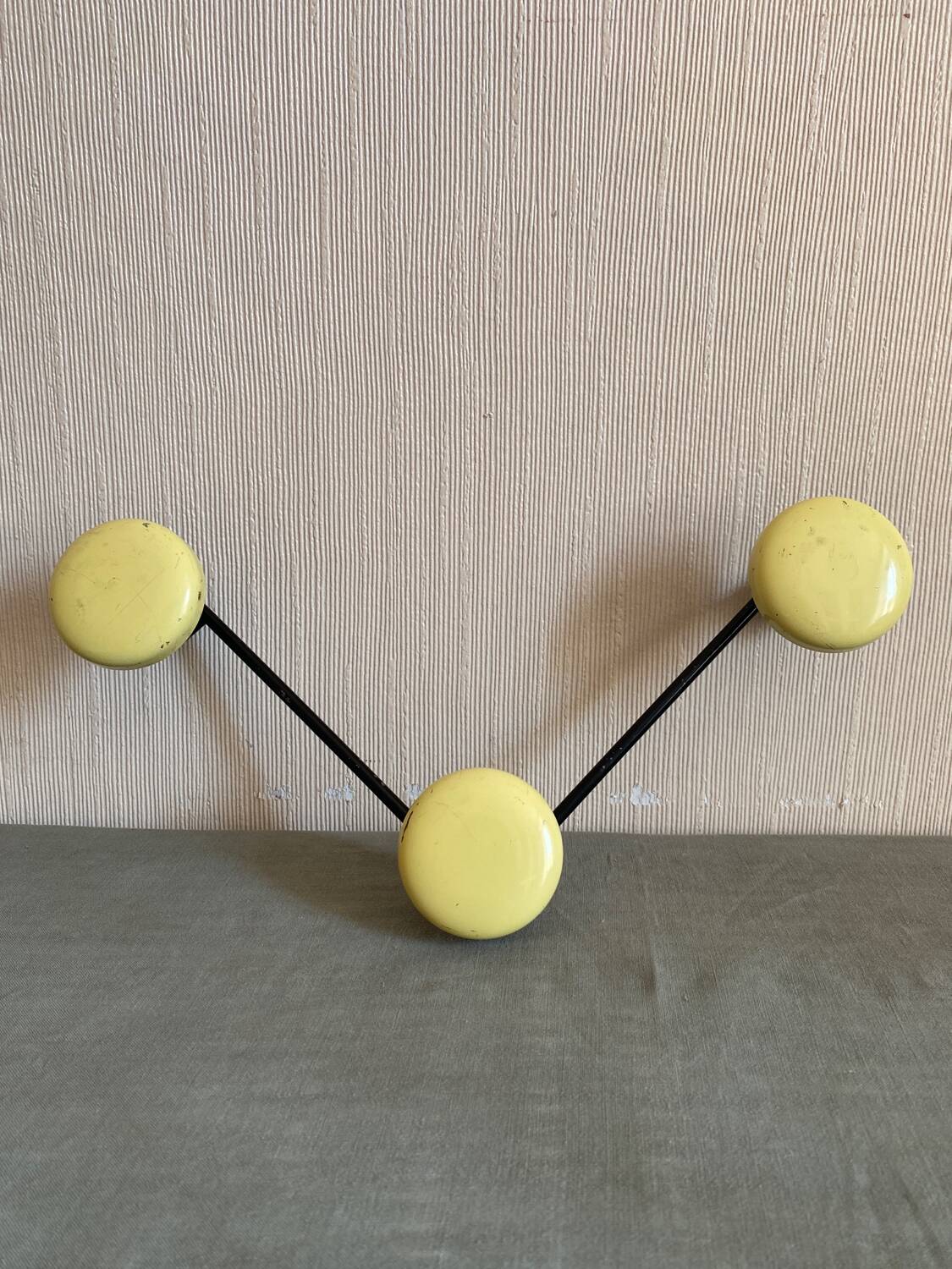 2 black and yellow metal wall coat racks