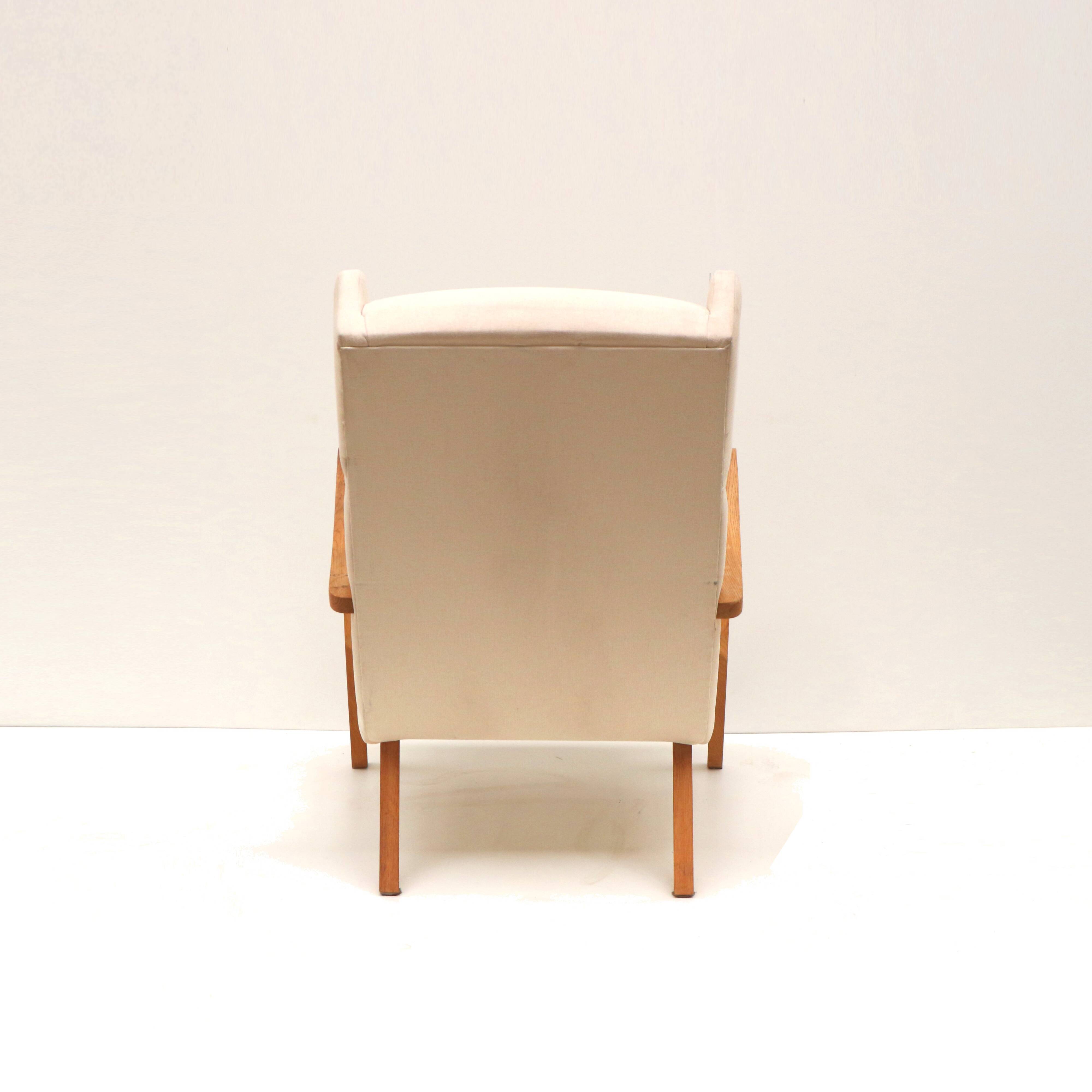 Danish design vintage armchair with cream upholstery from the 70s
