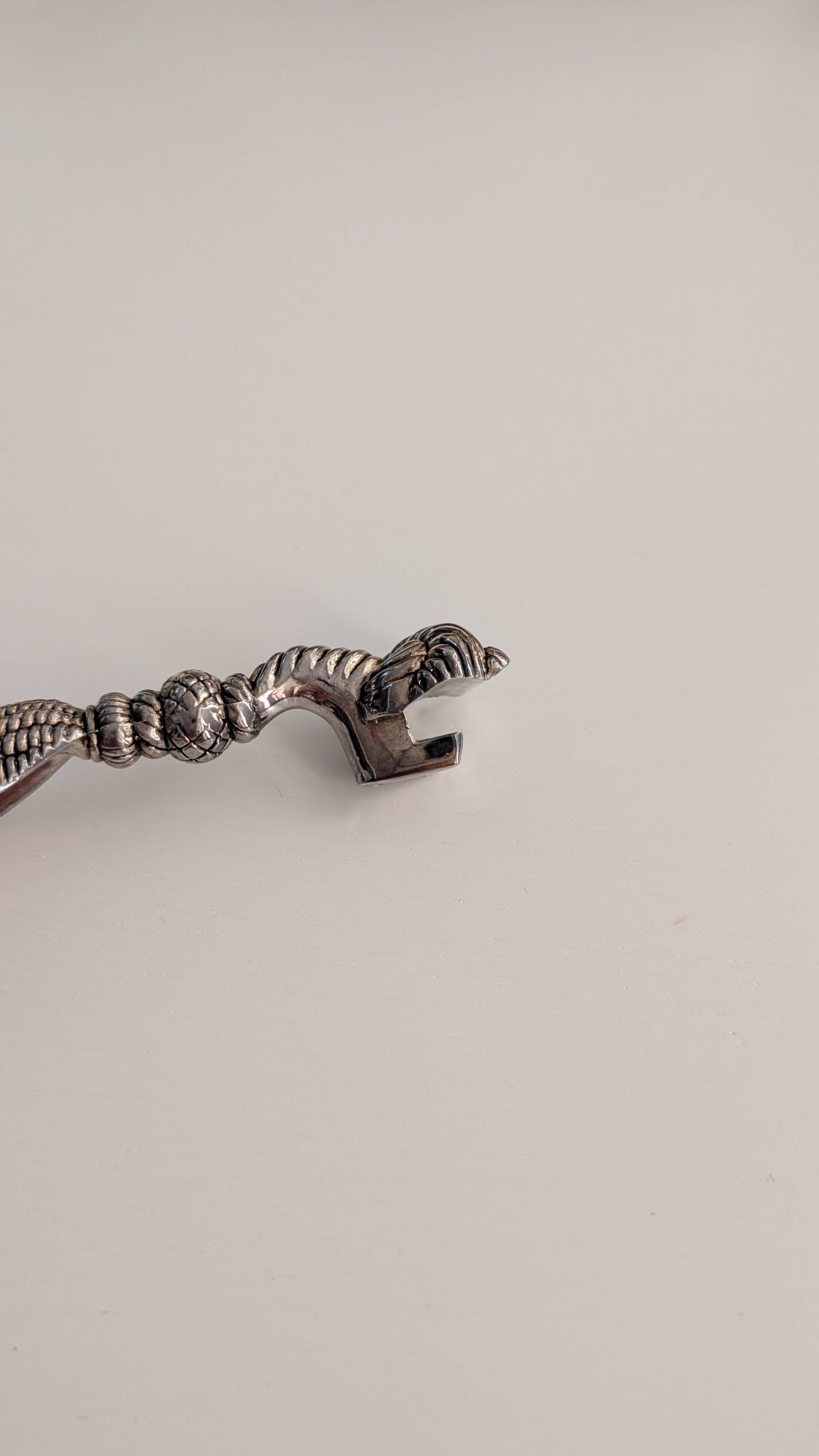 Vintage silver-plated bottle opener – pompom design