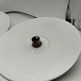 Suspensions in enamelled sheets