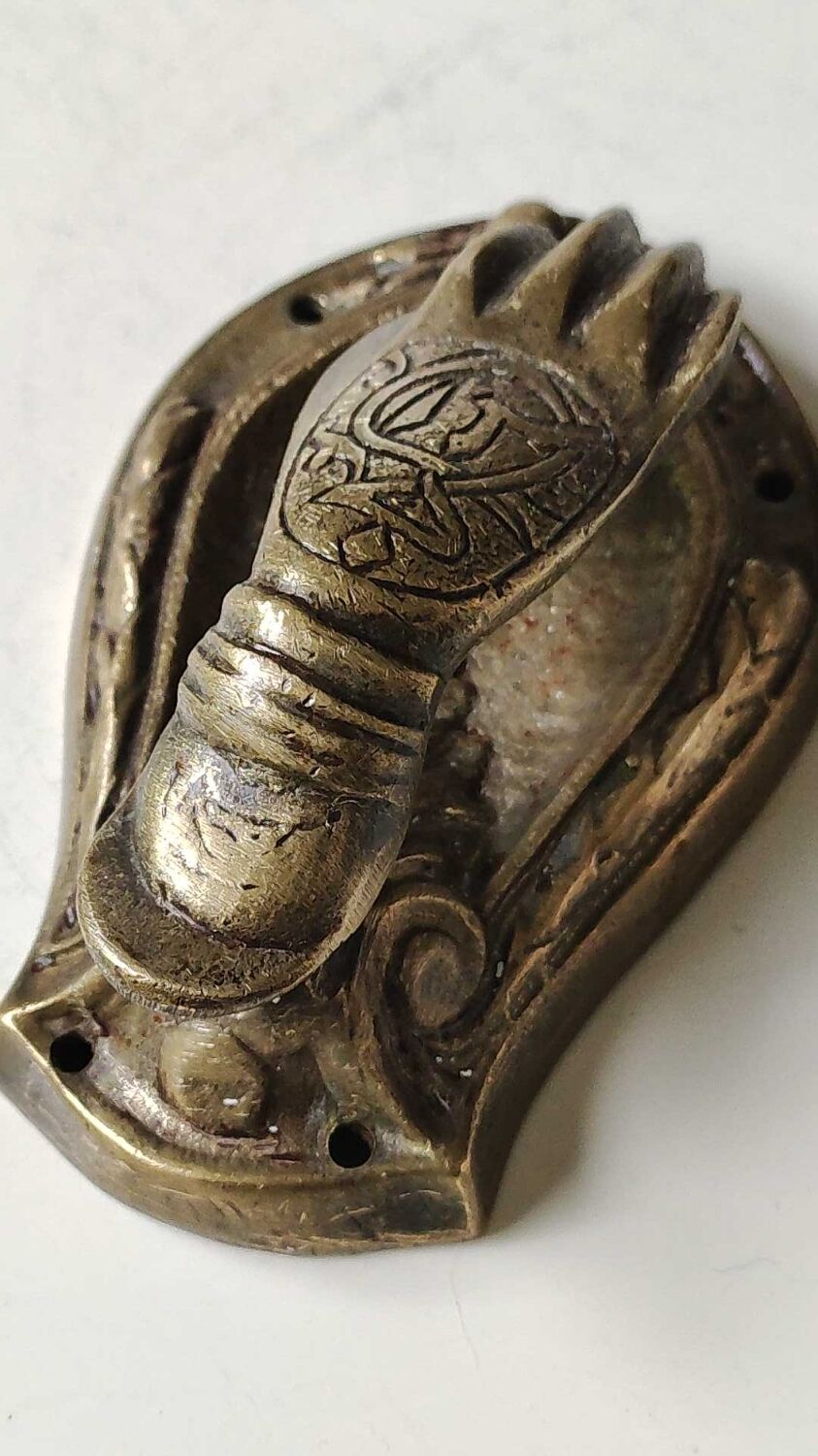 Door knocker in bronze