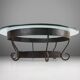 Rustic round coffee table with wrought iron base and glass top, France, 1930s