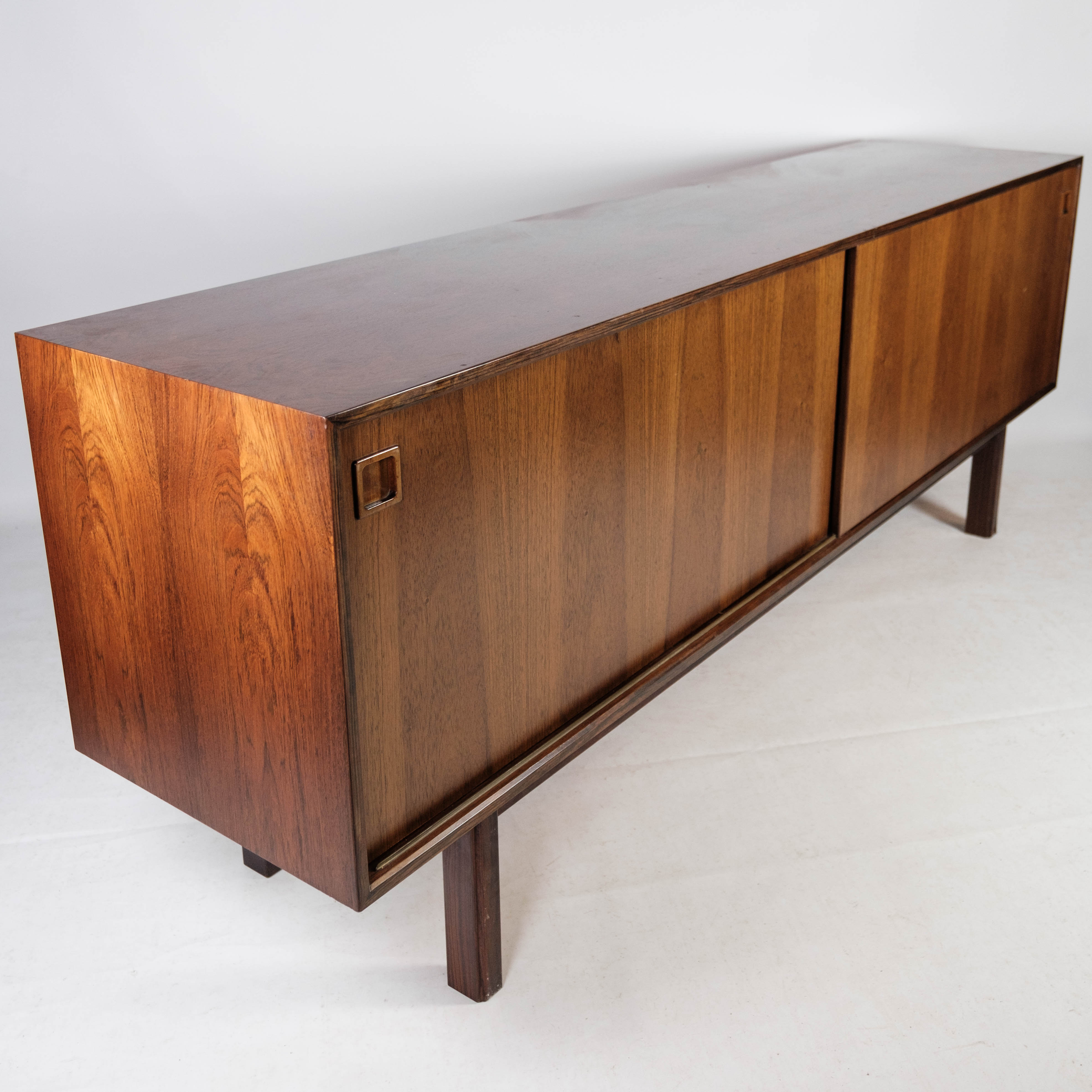 Sideboard in rosewood with sliding doors designed by Omann Junior from the 1960s.