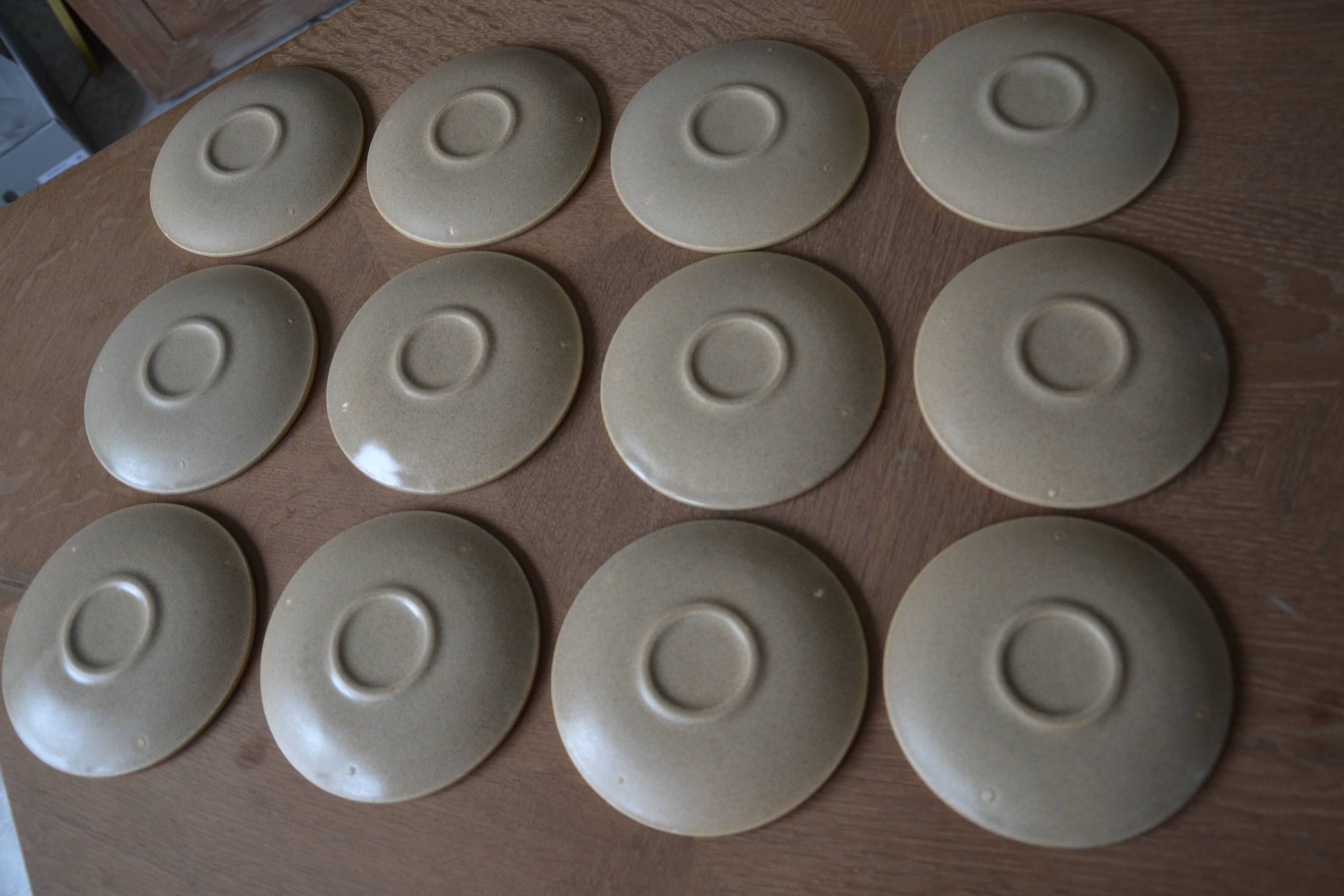 11 St Amand glazed stoneware cups and saucers/sugar bowl/milk jug