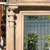 Imposing fireplace mirror in carved and painted wood, 19th century.