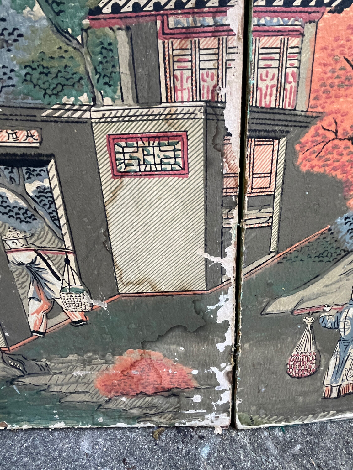Wooden screen in Asian style, covered with Chinese wallpaper.