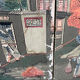 Wooden screen in Asian style, covered with Chinese wallpaper.