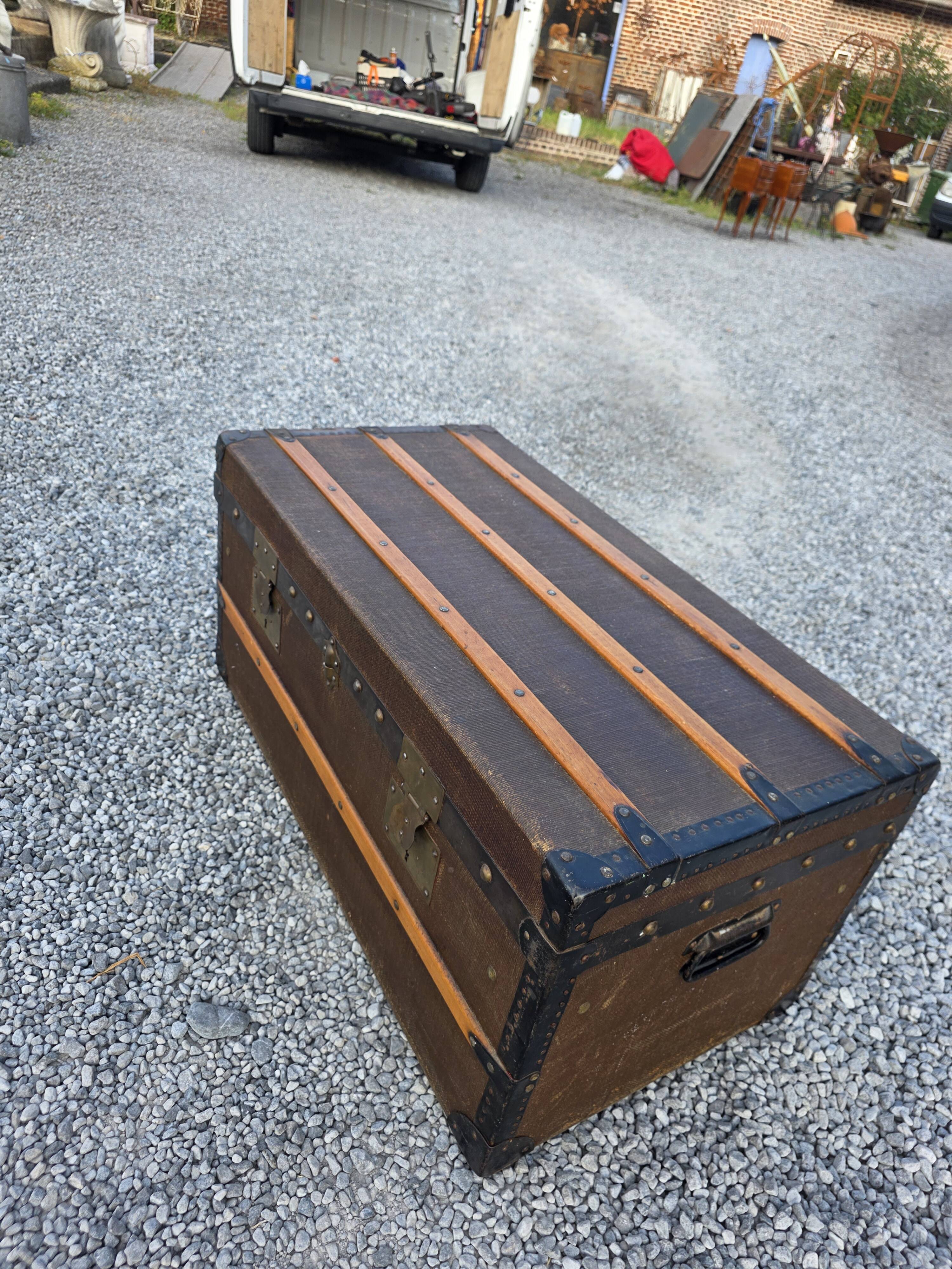 Old travel trunk in oilcloth