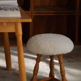 Modern Danish, a pair of tripod stools, seats reupholstered in lambswool, 1950s.