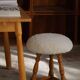 Modern Danish, a pair of tripod stools, seats reupholstered in lambswool, 1950s.
