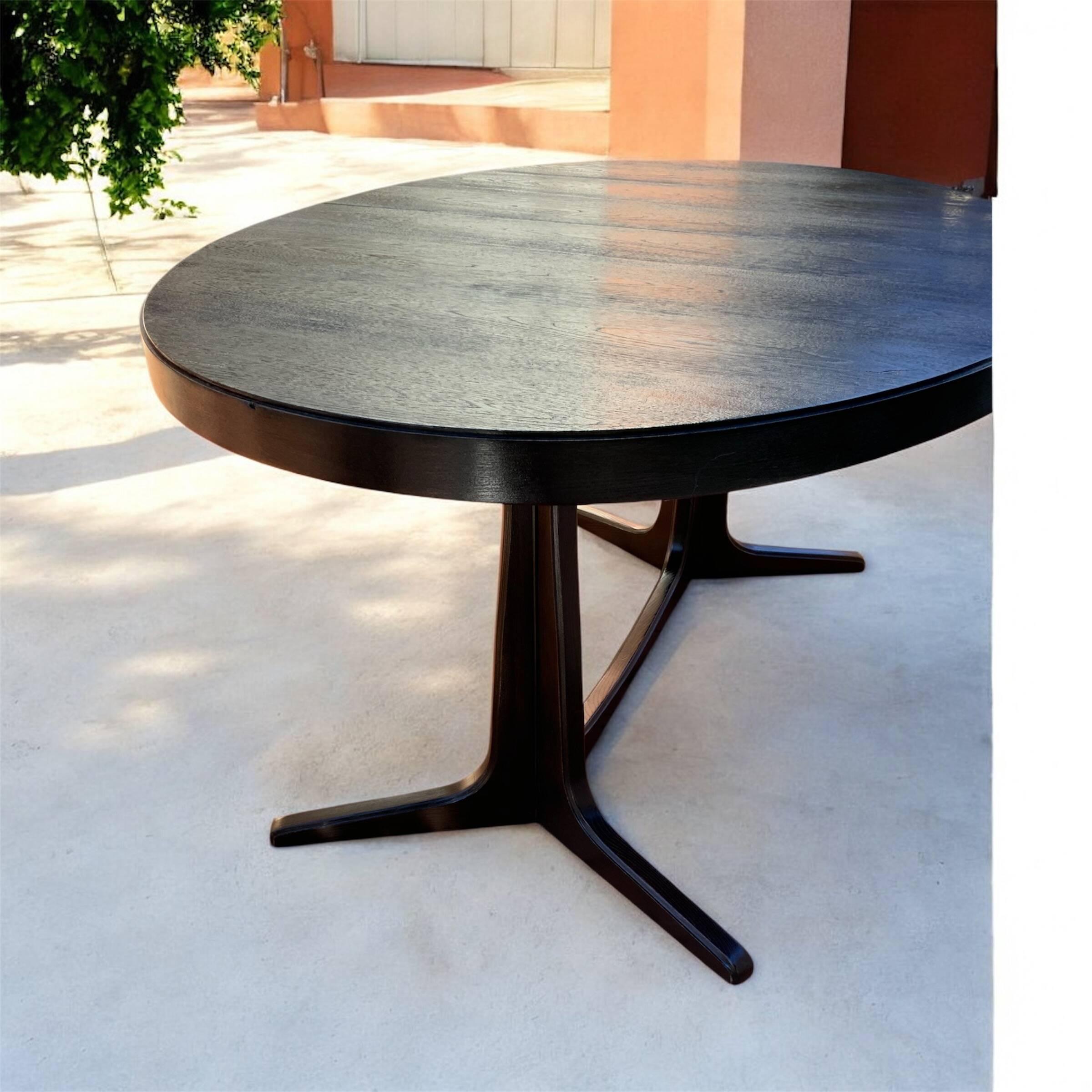 Oval extendable dining table in the style of baumann — ebonised black — vi