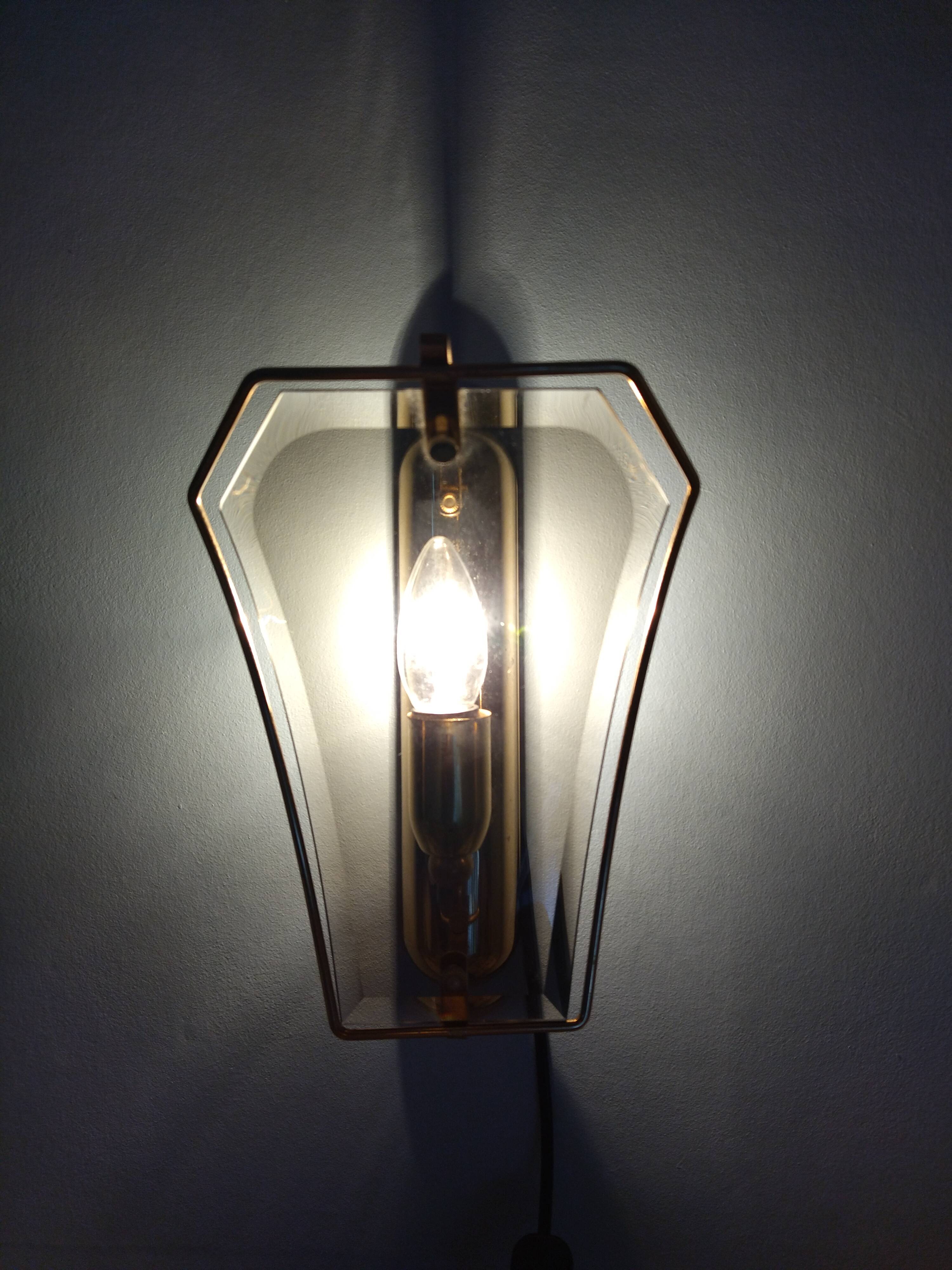 Pair of brass and curved glass wall lamps from the 80s