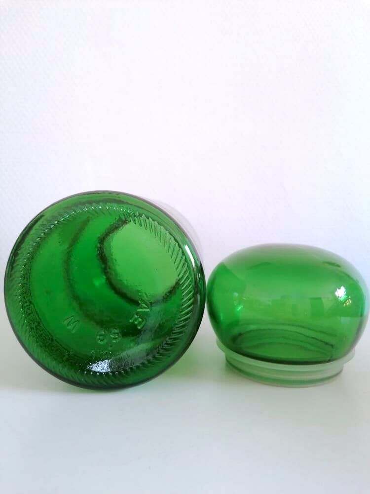 Apothecary jar in vintage green and gold glass