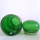 Apothecary jar in vintage green and gold glass