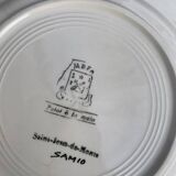 Collectible plate painted by Henry Simon, market gardening at the inn, in enameled ceramic,