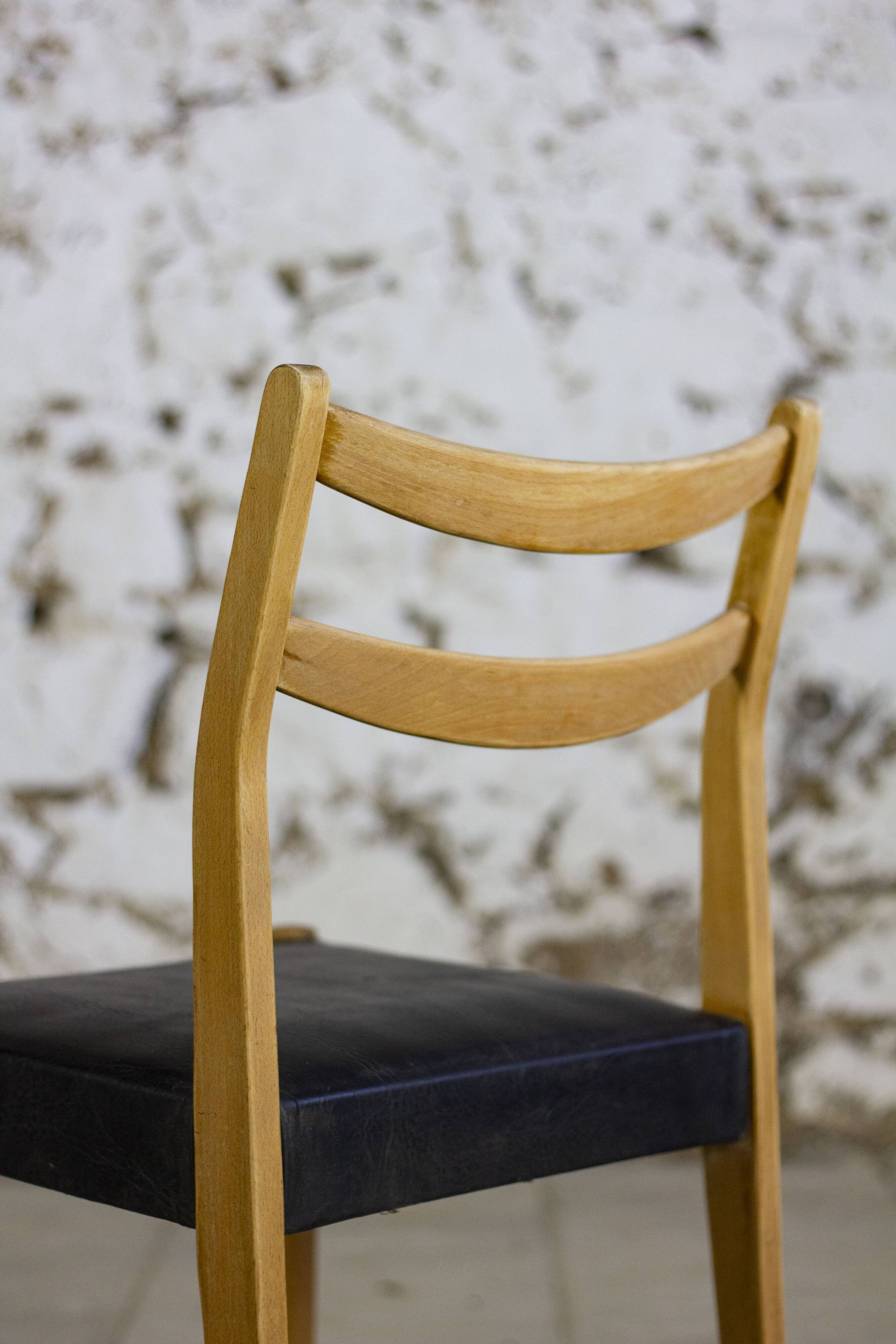 Pair of Scandinavian chairs in teak and faux leather, 1960.