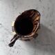 Striped decorative pitcher signed