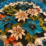 Decorative flower plate in reliefs