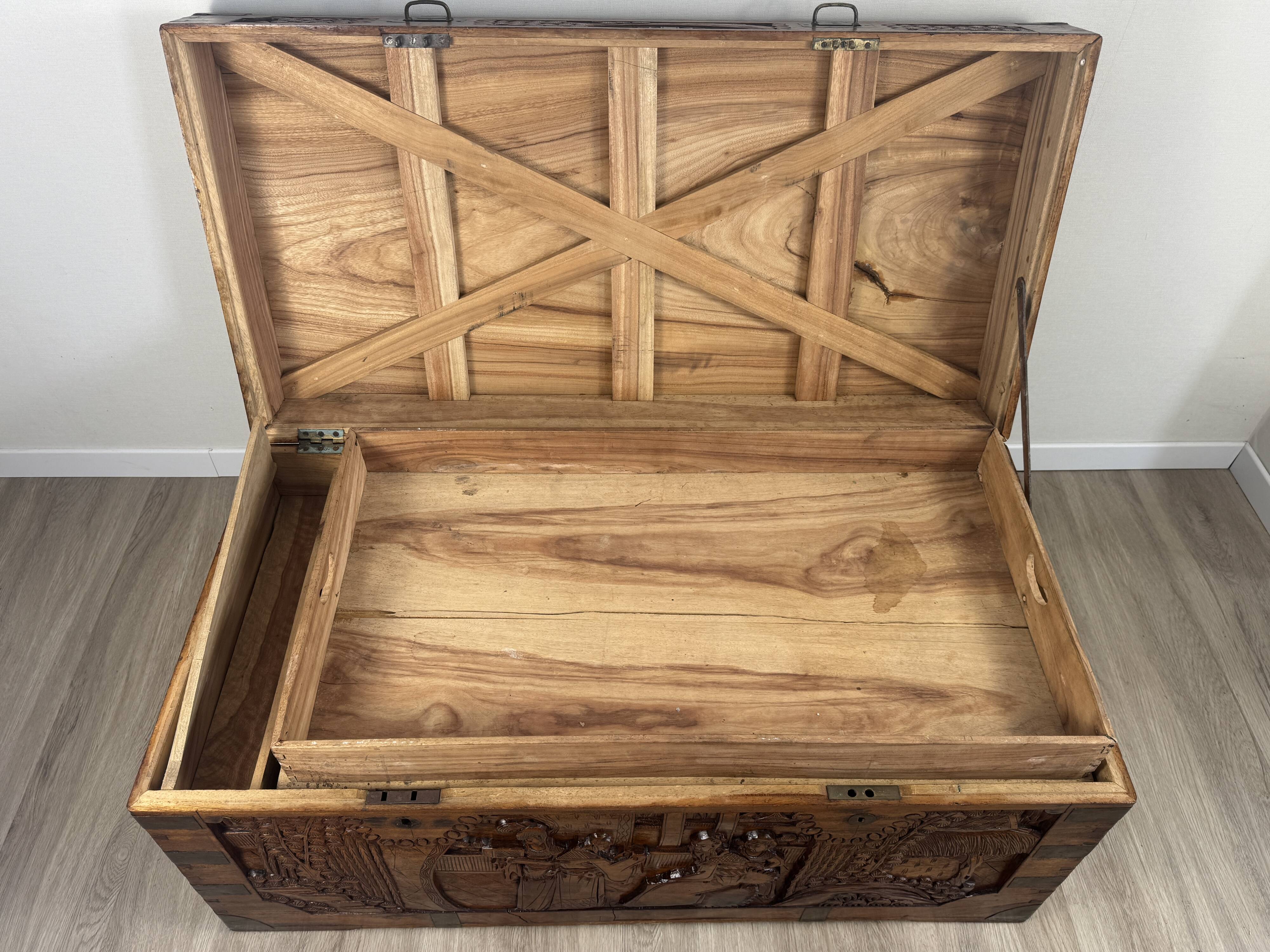 Chinese carved chest made of solid wood — life scenes in bas-relief