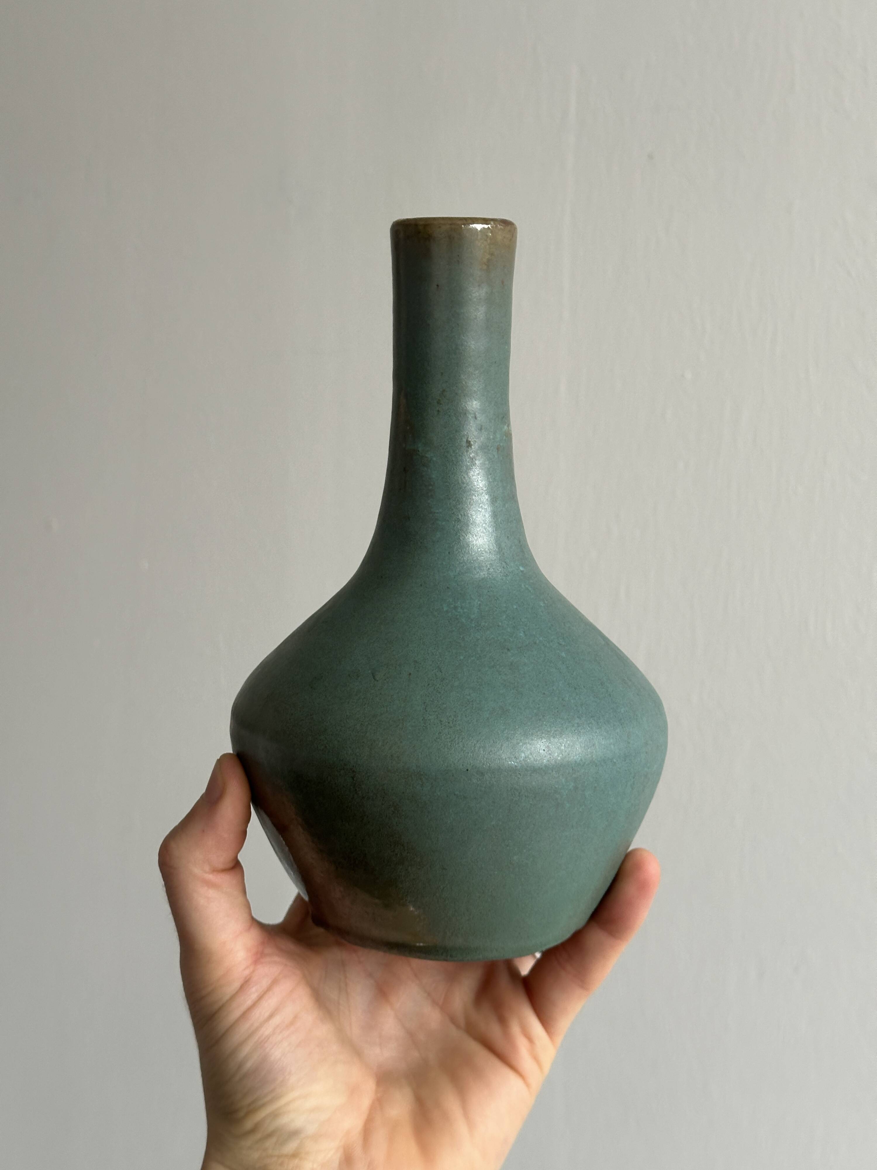 Green glazed ceramic vase
