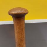 Imposing ancient ceramic pestle and wood
