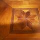 Square cherry wood table with drop leaves.