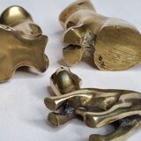 Set of three brass cats