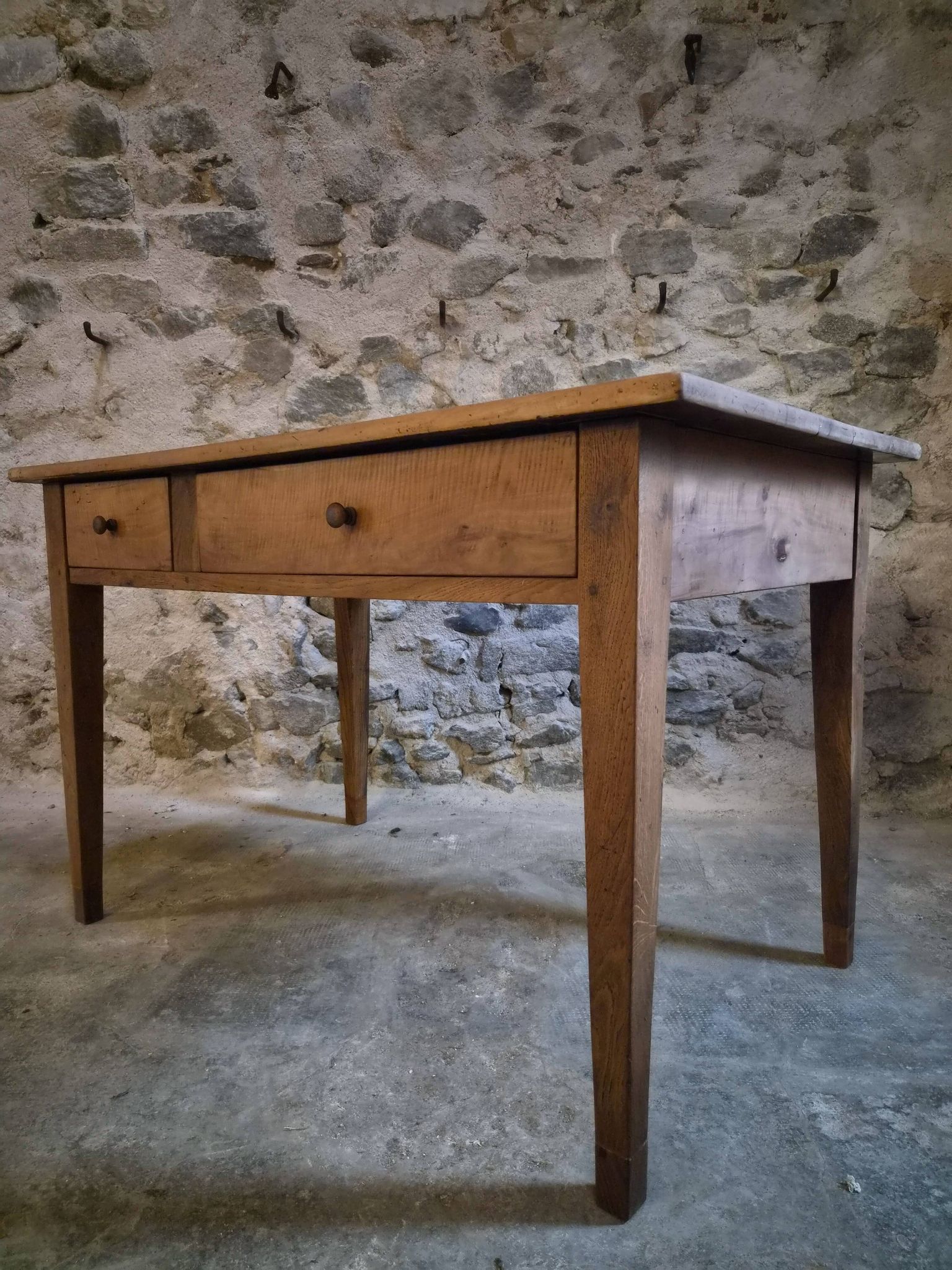 French antique dining table in cherry wood with two drawers, circa 1880–1920.