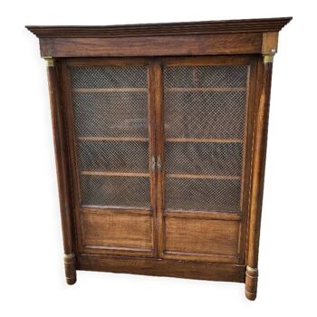 Empire bookcase in walnut with columns of the nineteenth century
