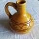 Round ochre glazed jug with handle