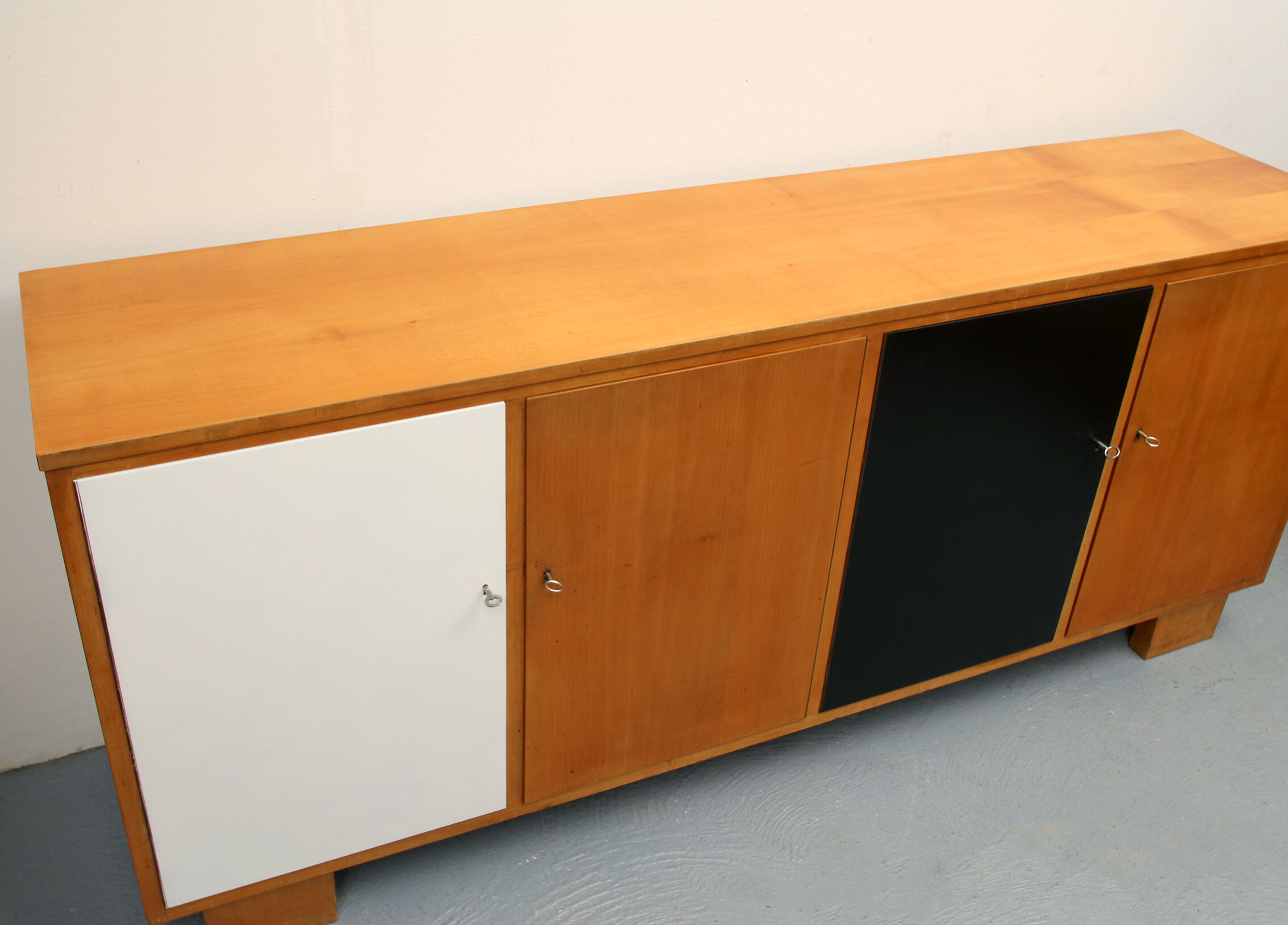 Sideboard in cherrywood with black and white doors 1950s