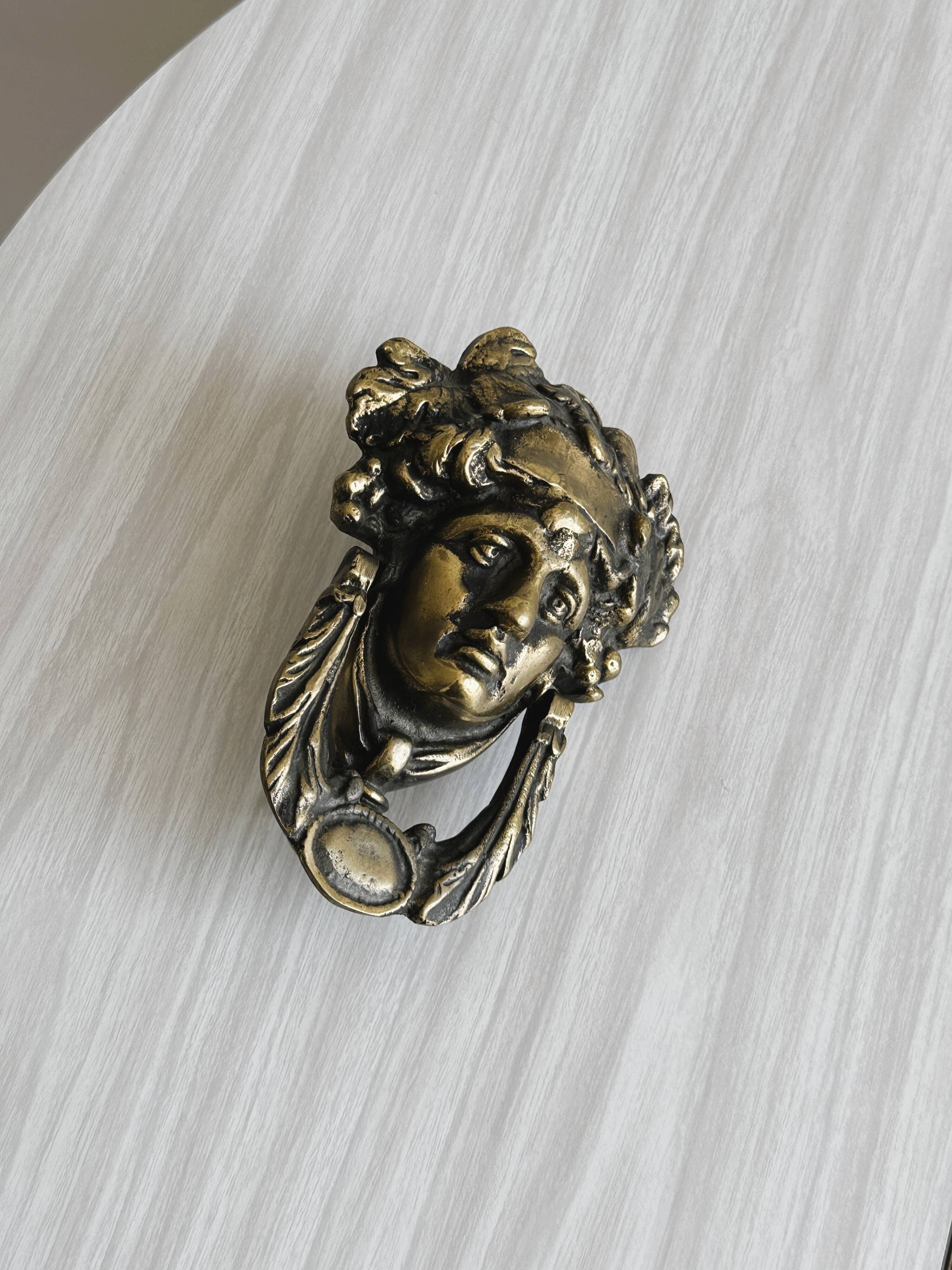 Large antique style brass metal knocker.