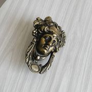 Large antique style brass metal knocker.