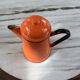 Orange and black enamelled sheet metal coffee maker