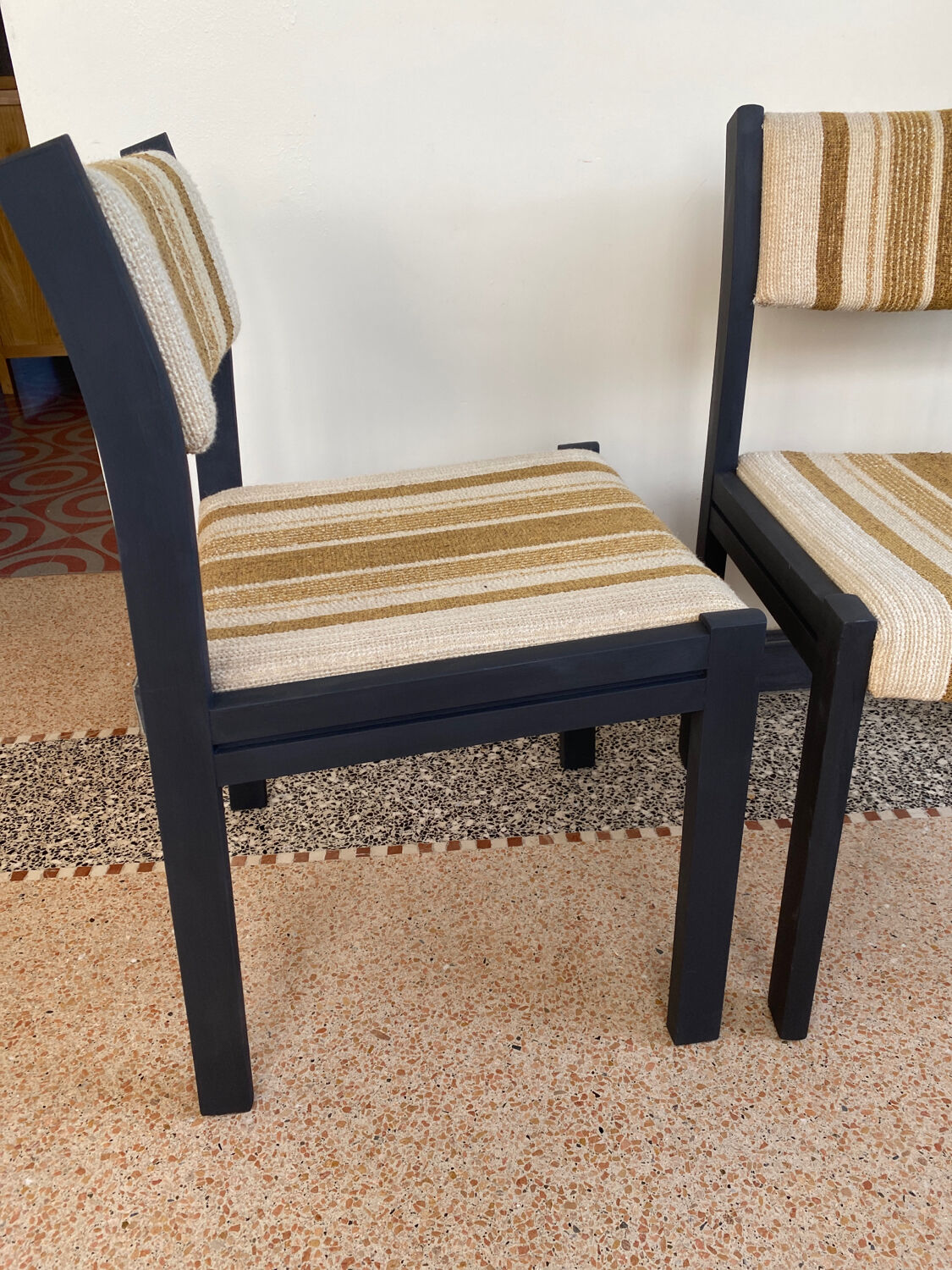 2 wooden chairs and vintage fabric