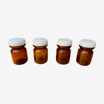 Set of 4 jars in vintage amber glass