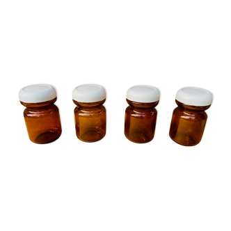 Set of 4 jars in vintage amber glass