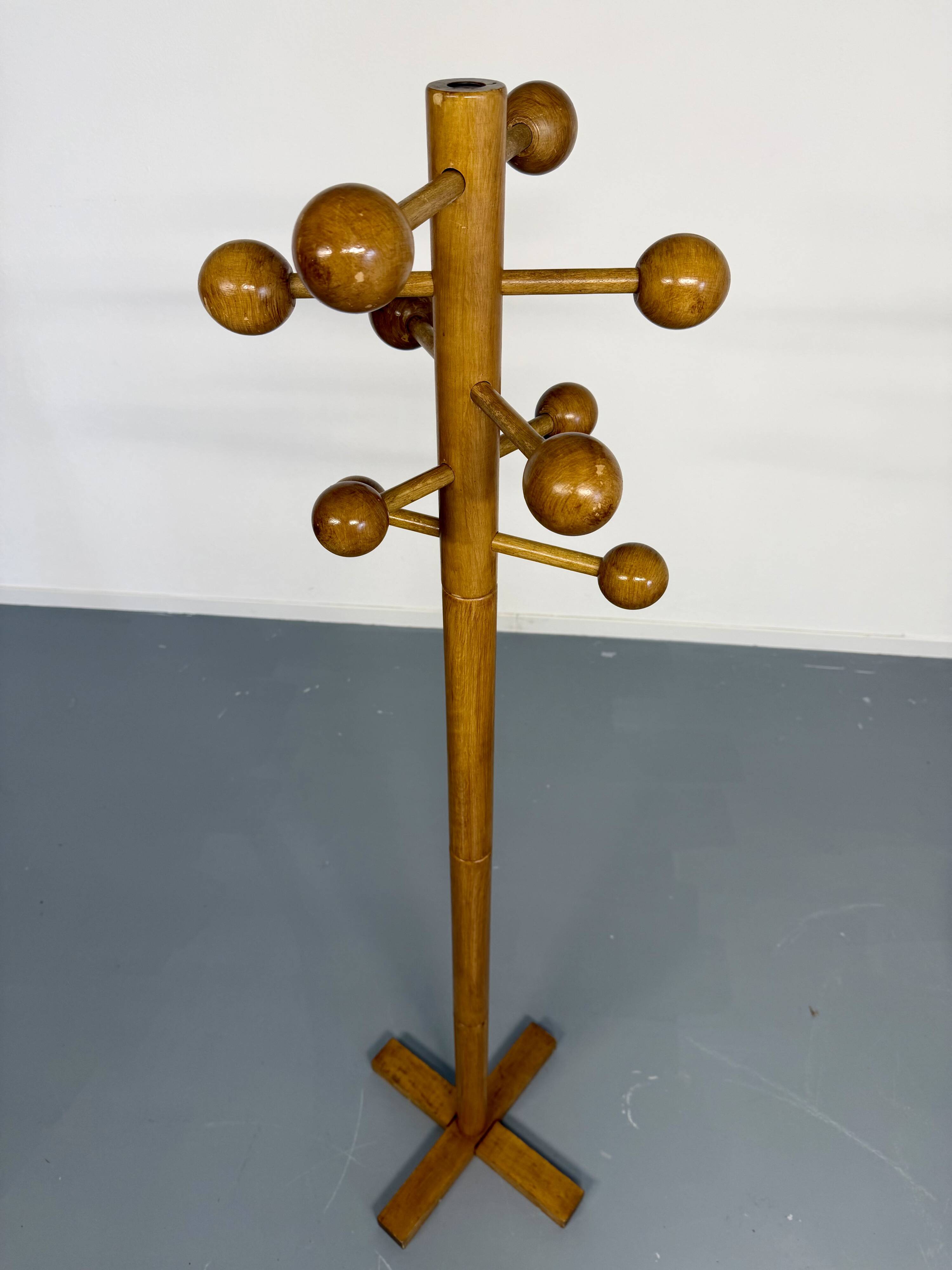 Vintage wooden coat stand with modernist design from the 1970s.